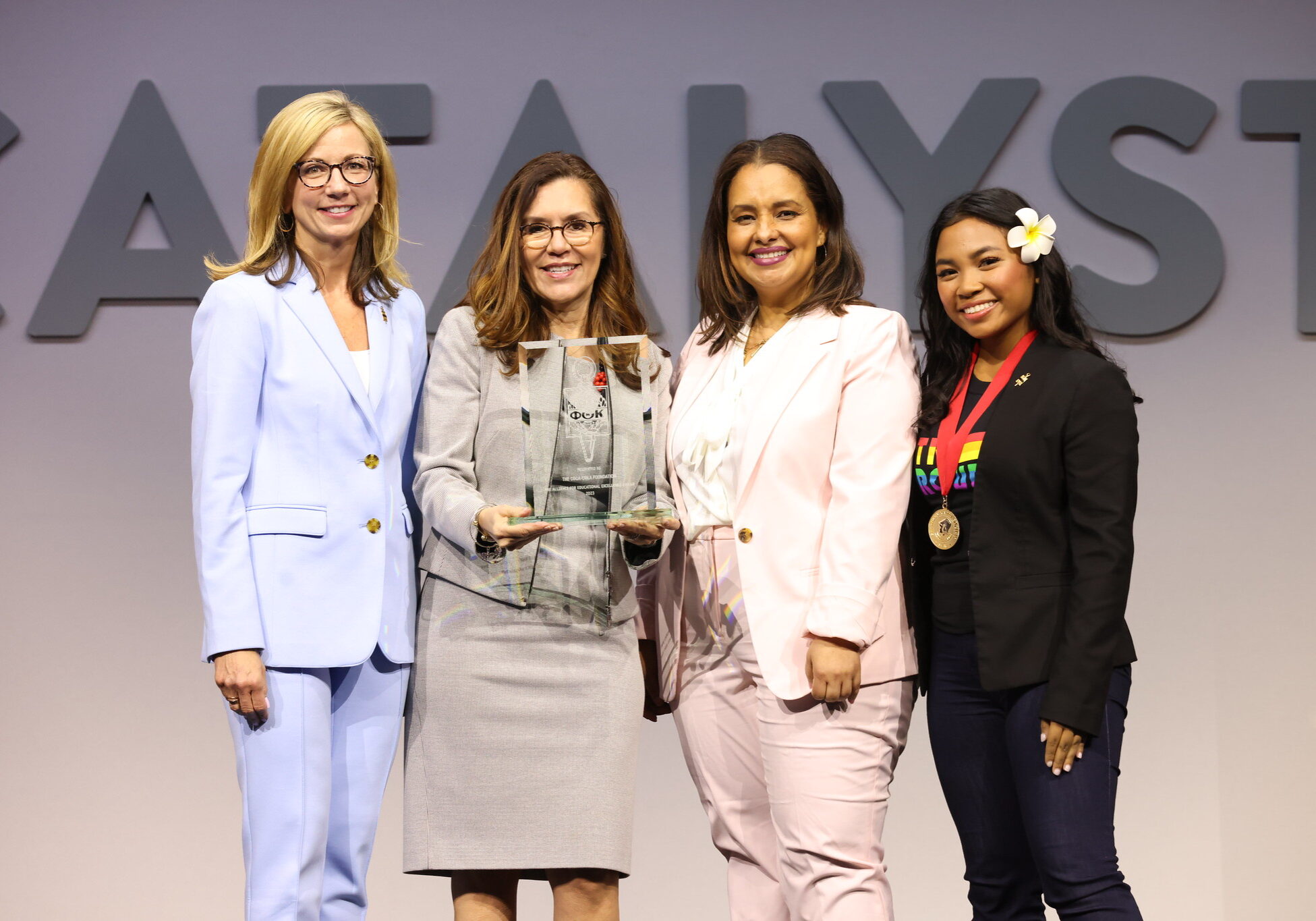Coca-Cola’s Vice President of Community and Stakeholder Relations <b>Alba Baylin</b> accepts the Alliance for Educational Excellence Award on behalf of the Coca-Cola Foundation during PTK Catalyst 2023 in Columbus, Ohio. Also pictured, Phi Theta Kappa Foundation’s Executive Director <b>Dr. Monica Marlowe</b>, Chief Opportunity Officer <b>Dr. Nancy Sanchez</b>, and 2022-23 International Co-President <b>Keziah Ancheta</b>.